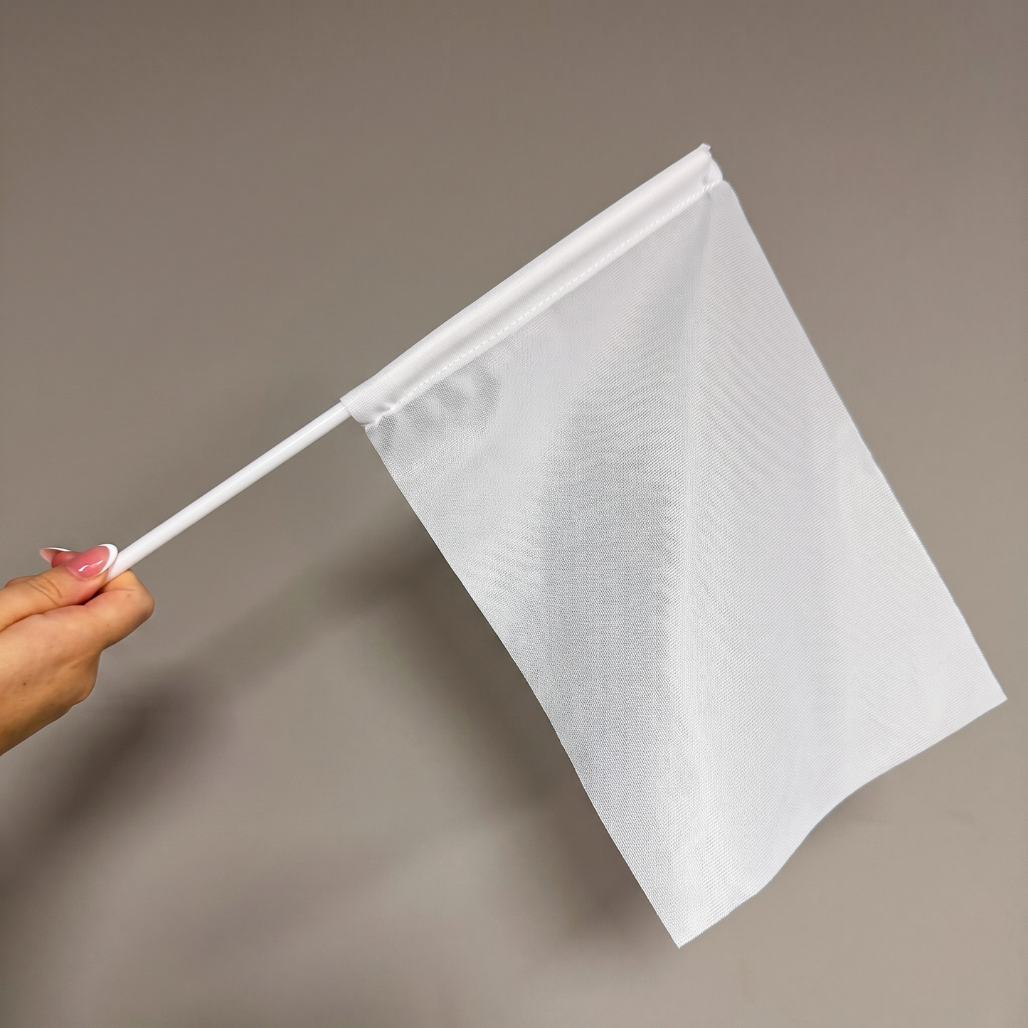 Blank custom hand waving flag on a white handheld pole showing the printable flag area.