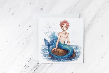 Pastel Merman Greeting Card – Soft Watercolour Ocean Fantasy – Femboy Merboy on Rock Illustration – Handmade Mythical Sea Creature