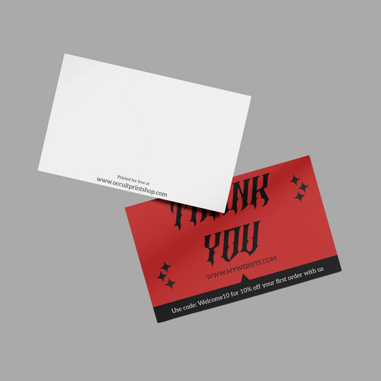 Red and black business card with 'Thank You' text on a beige surface.