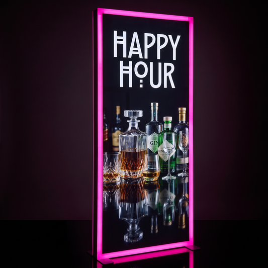 A vertical illuminated bar sign with a bright pink neon border, displaying the words “HAPPY HOUR” in large white letters above a photo of assorted liquor bottles and glasses on a dark background.