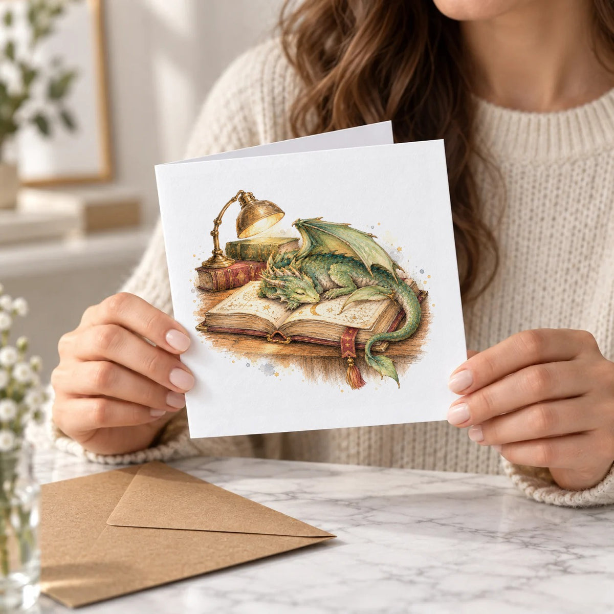 Sleeping Dragon on a Spellbook Greeting Card – Held Card
