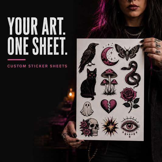 A person holds a custom sticker sheet featuring gothic and horror-themed illustrations including a raven, cat, snake, mushroom, skull, eye, ghost, and rose. The left side of the image features promotional text reading 'YOUR ART.