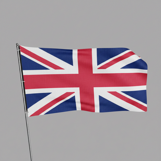 A small United Kingdom flag on a silver metal pole, shown waving against a solid gray background.