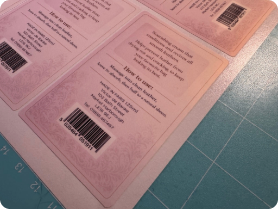Custom sticker sheets in production showing back product labels and barcodes