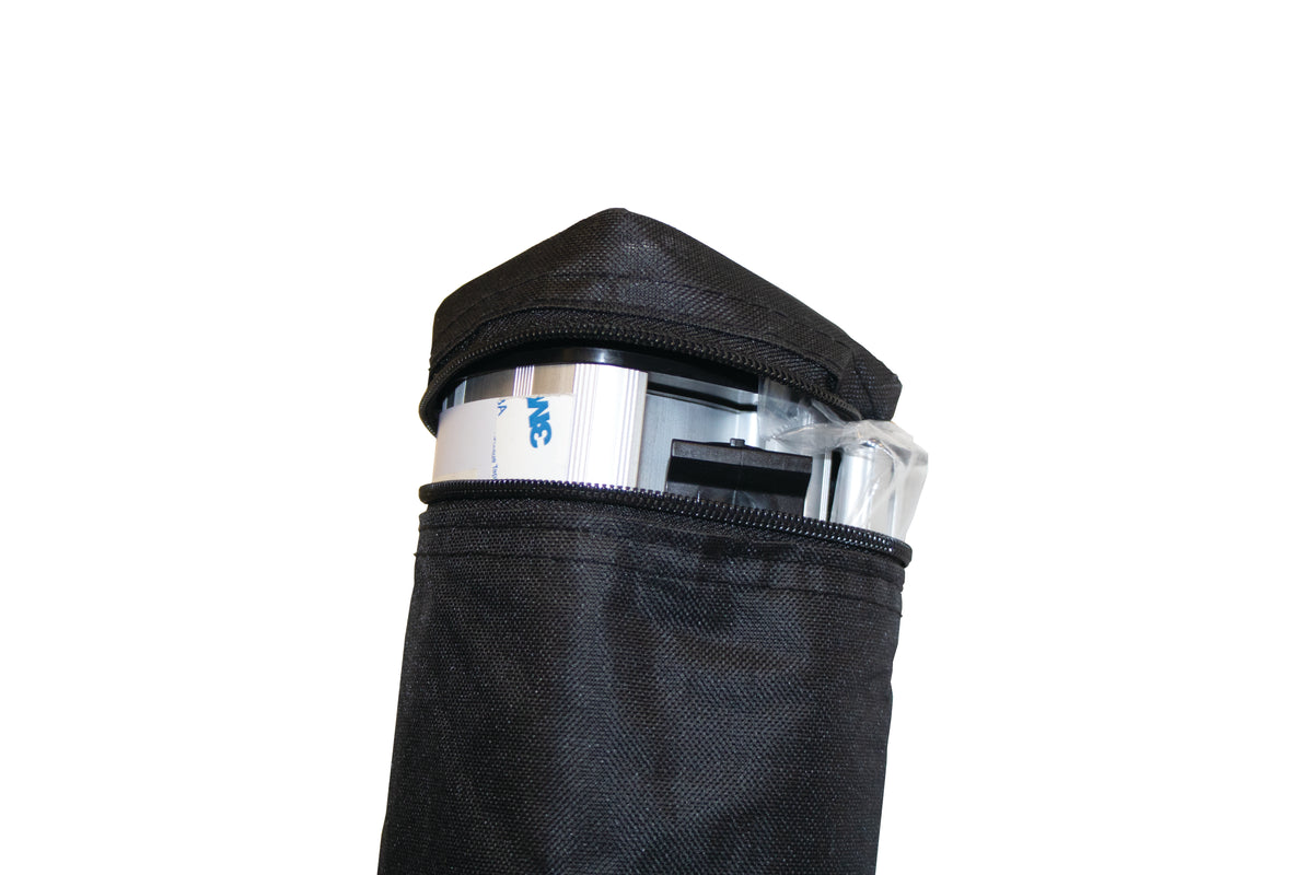 Economy roller banner hardware partly packed into its replacement carry bag