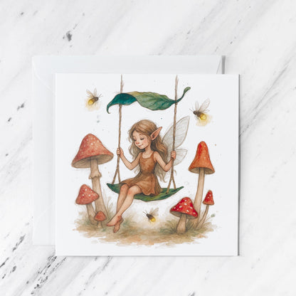 Fairy Mushroom Swing Card featuring whimsical watercolour woodland illustration, illustrated greeting card